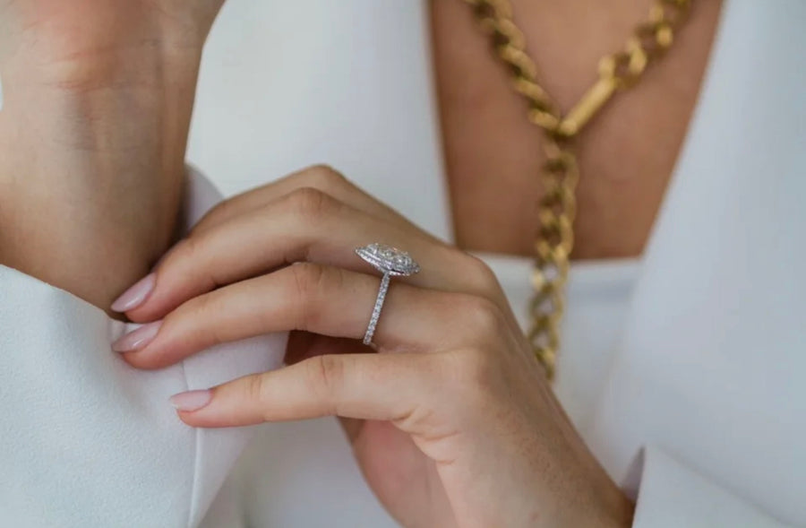Bride styling the Portia pear Moissanite ring, showcasing elegant double halo design