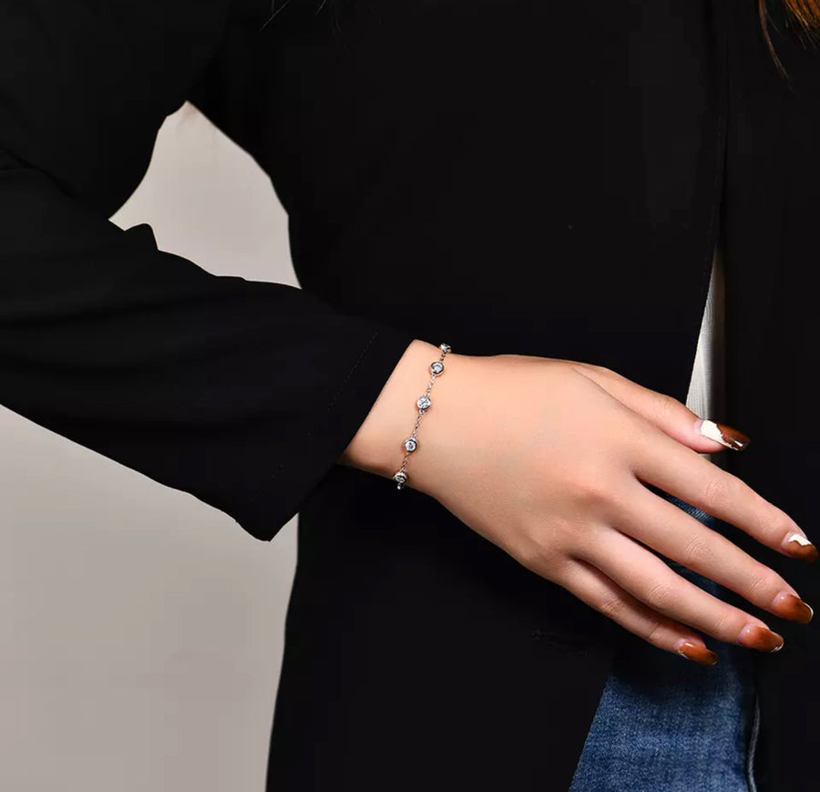 Model styling the Rhianna bracelet in an evening outfit.