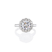 Top view of Annalise ring with a round-cut moissanite centre stone surrounded by a halo of smaller moissanite stones