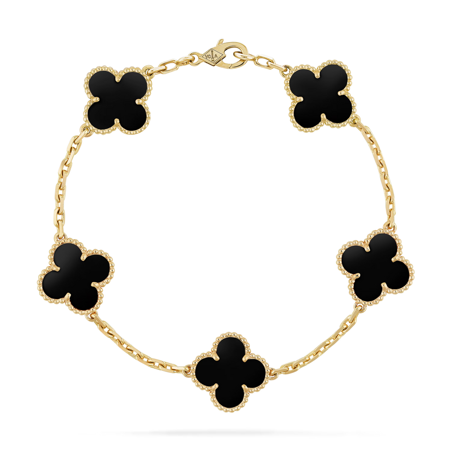 Gold bracelet with black clover-shaped charms on a white background