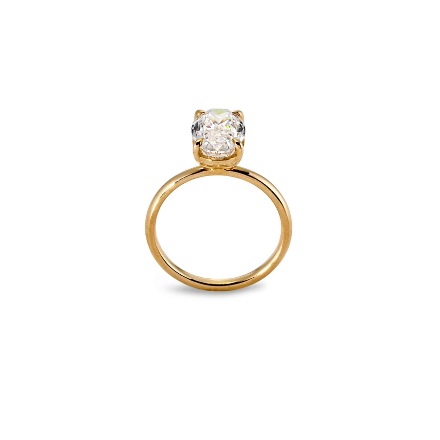 Side view of oval moissanite solitaire ring showing prong setting and polished yellow band