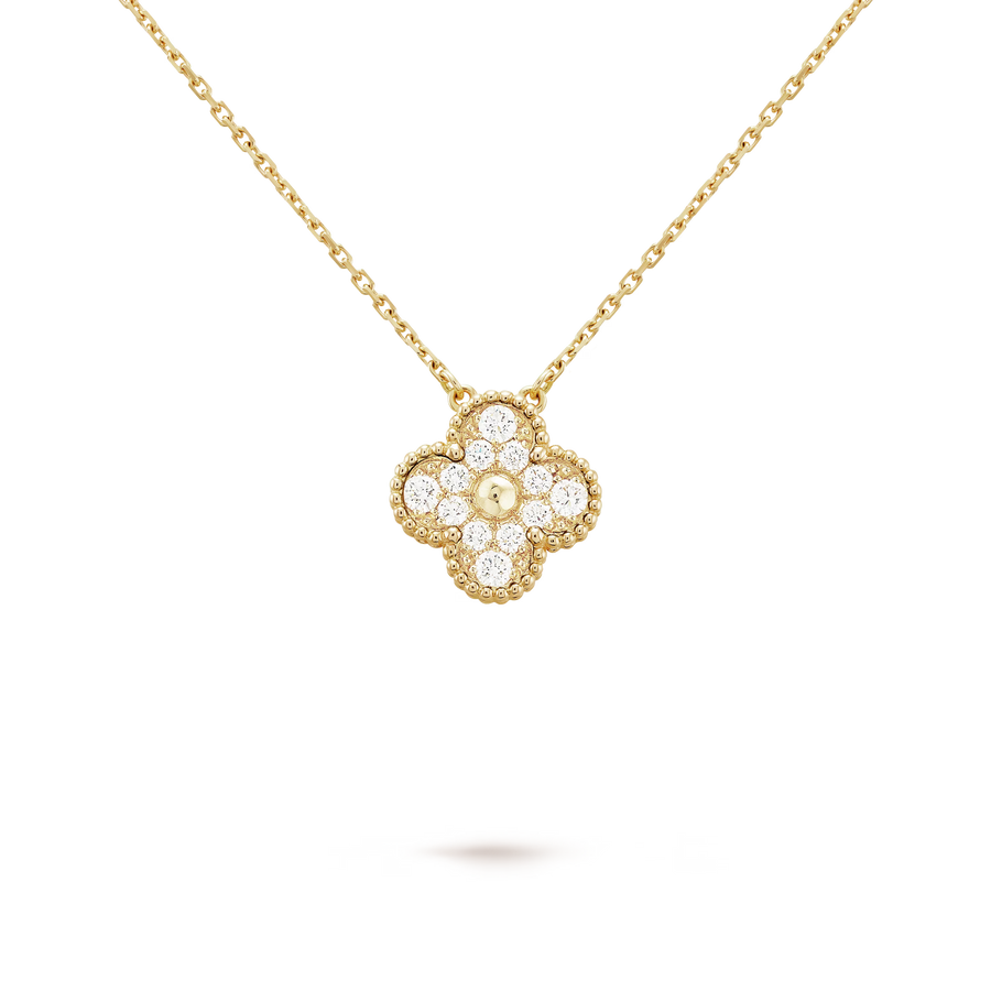Gold necklace with a diamond pendant on a black background