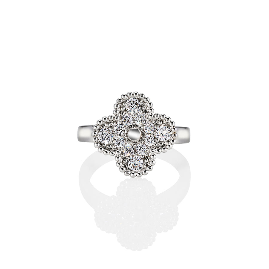 Side view of silver ring with pavé-set moissanite four-leaf clover and beaded trim