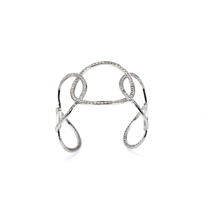 Top-down view of open cuff bracelet with interwoven moissanite-set loops in silver finish