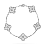 Silver bracelet with floral designs on a white background
