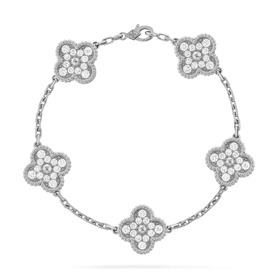 Silver bracelet with floral designs on a white background