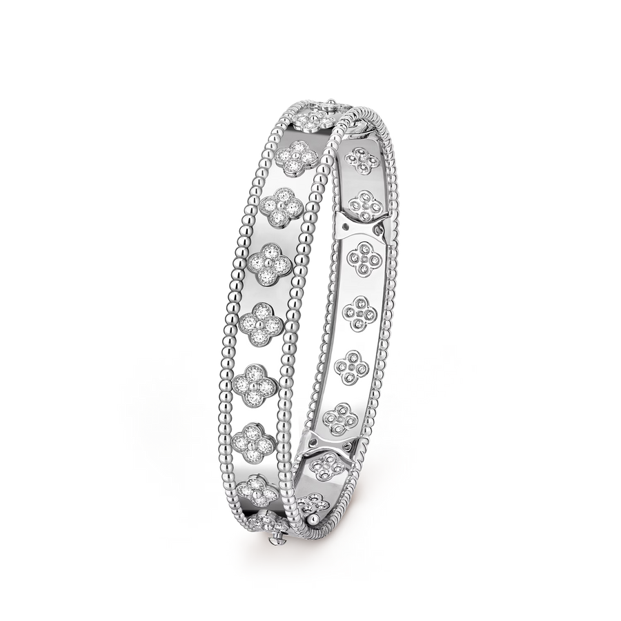 Silver ring with floral designs on a transparent background