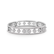 Silver bracelet with floral designs on a black background