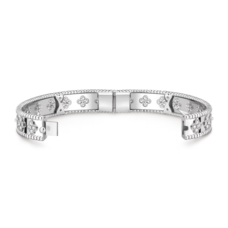 Silver bracelet with intricate designs on a white background