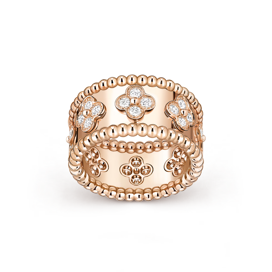 Rose gold ring with clover designs and diamonds on a transparent background