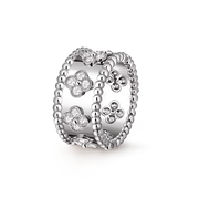 Silver ring with floral designs on a white background