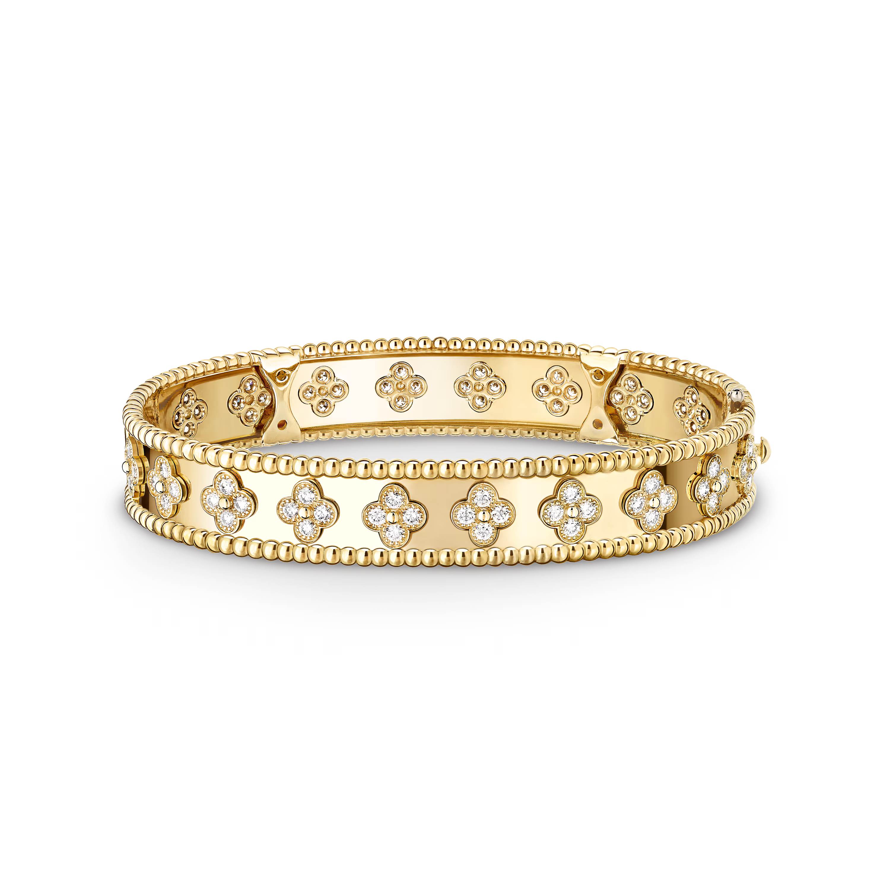 Gold bracelet with floral designs on a black background