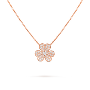 Rose gold necklace with a clover-shaped pendant on a black background