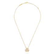 Gold necklace with a floral pendant on a black background