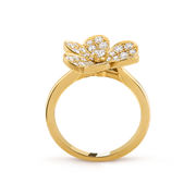 Gold ring with a bow-shaped diamond design on a transparent background