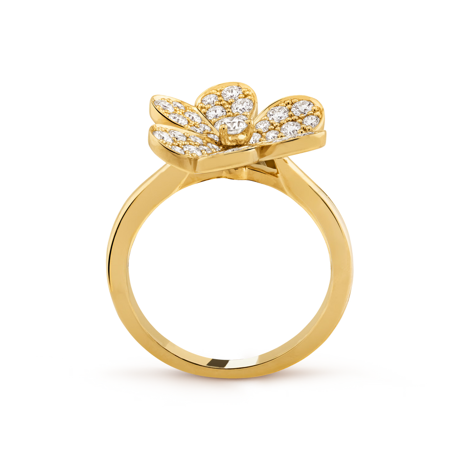 Gold ring with a bow-shaped diamond design on a transparent background