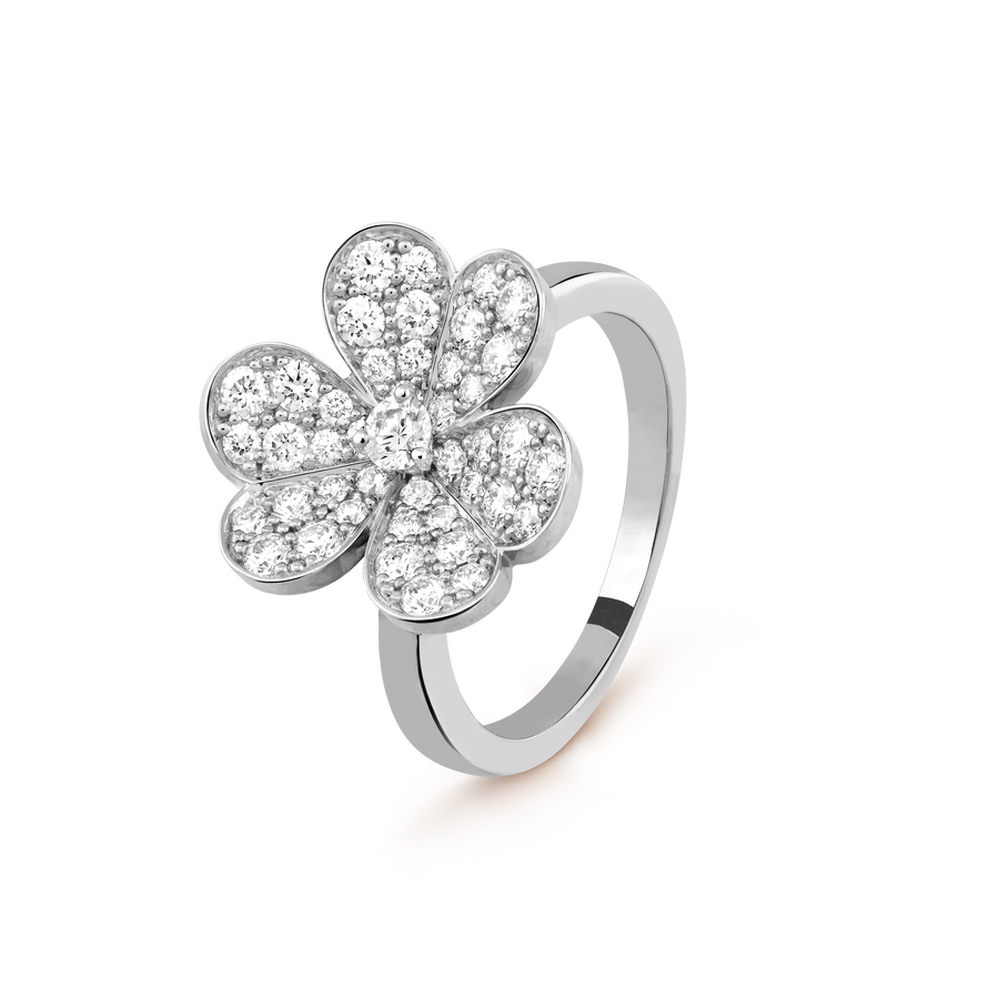Silver flower-shaped ring with clear gemstones on a white background