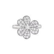 Flower-shaped silver ring with clear gemstones on a white background