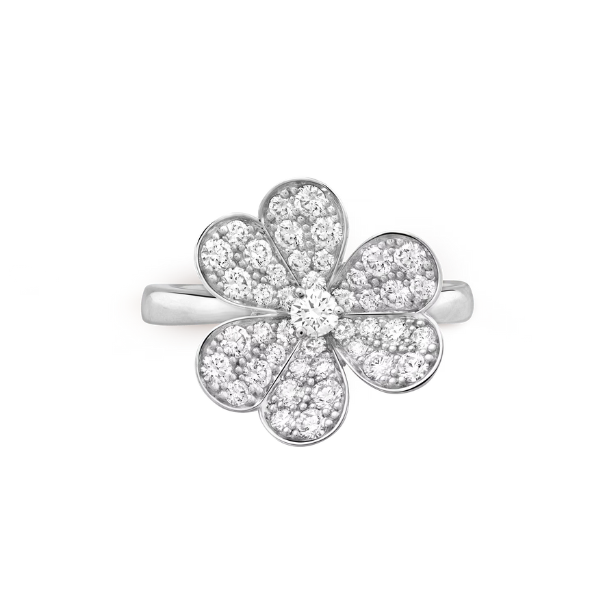 Flower-shaped silver ring with clear gemstones on a white background