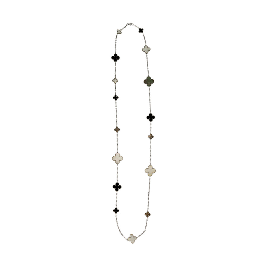 Full length view of Long Clover necklace laid out flat with evenly spaced multi-inlay four-leaf clover charms