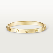 Gold bracelet with Love lock design on a light gray background