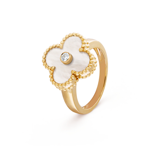 Gold ring with a white flower-shaped design and central gemstone on a transparent background