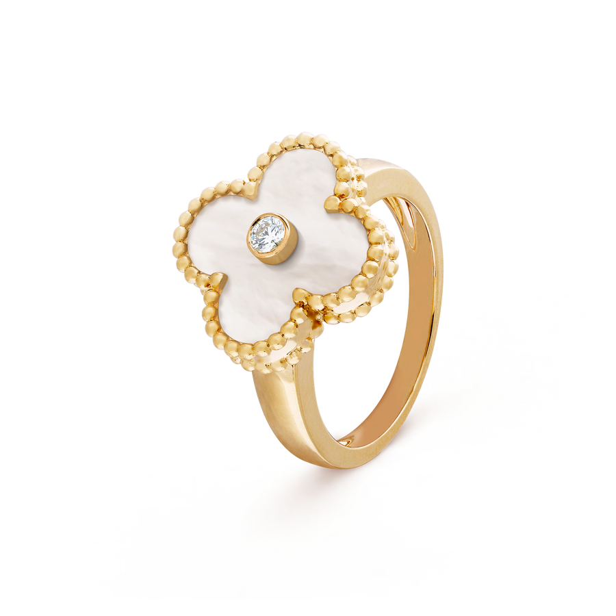 Gold ring with a white flower-shaped design and central gemstone on a transparent background