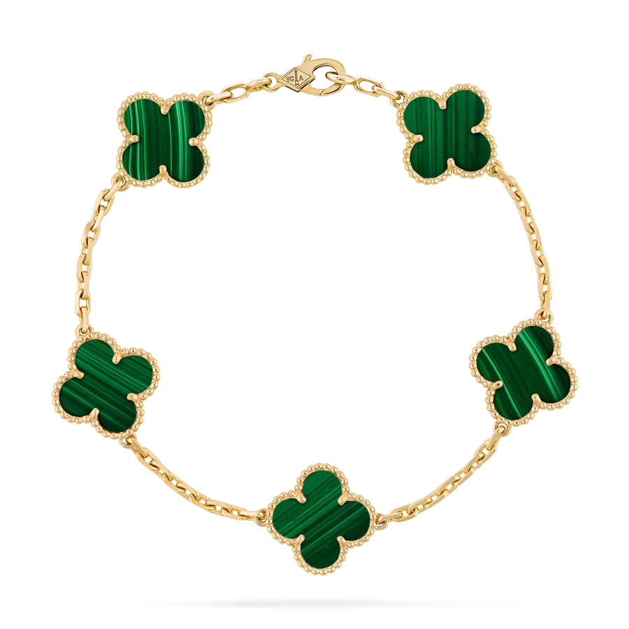 Top-down view of gold clover bracelet featuring five green malachite inlays and beaded trim