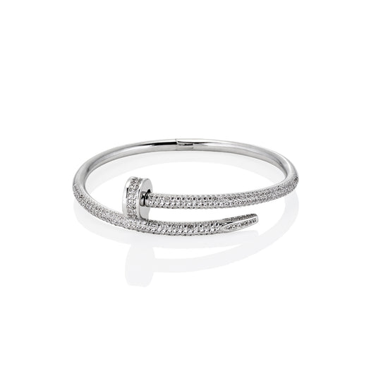 Side view of silver nail bracelet with full pavé moissanite wrapping and open-ended wrap design