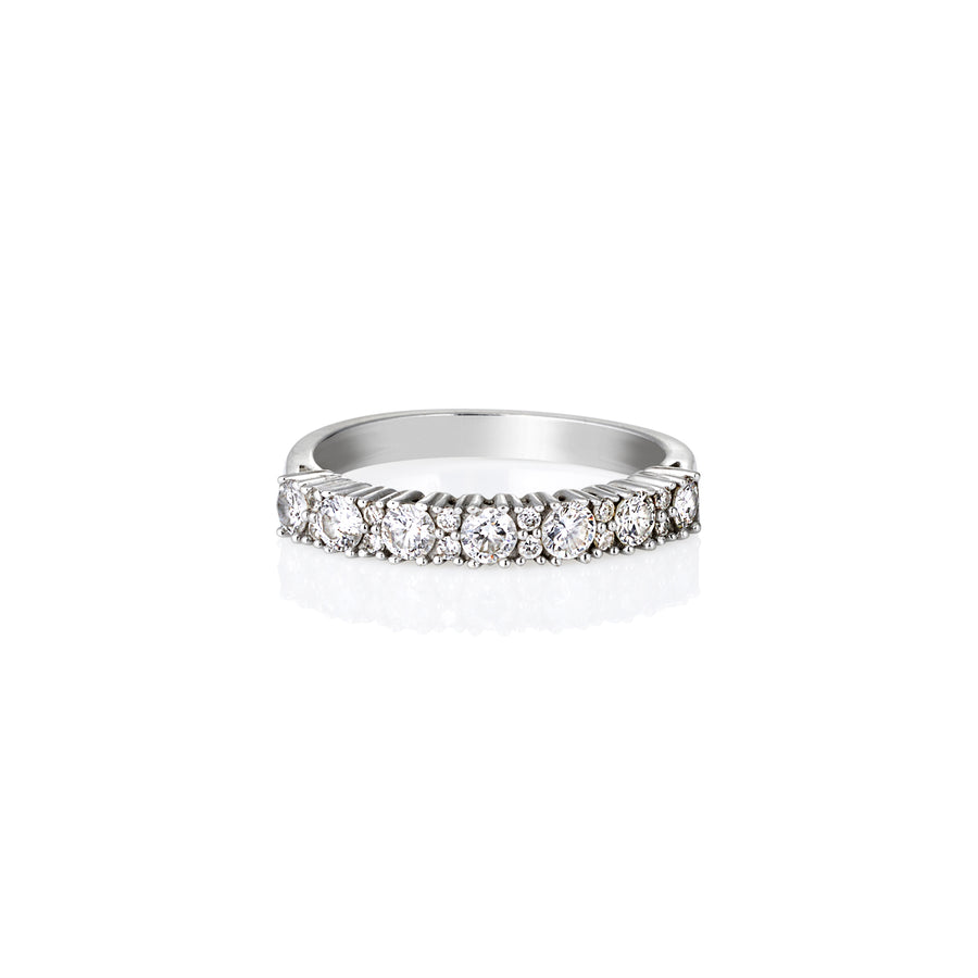 Side view of slim moissanite half eternity ring with round pavé stones, perfect for stacking.