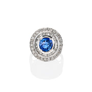 Top view of Nita ring featuring round-cut blue sapphire surrounded by moissanite double halo