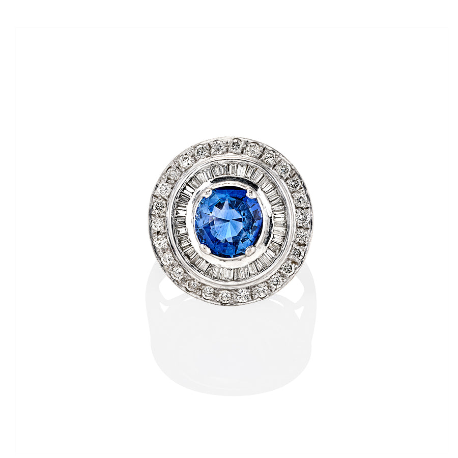 Top view of Nita ring featuring round-cut blue sapphire surrounded by moissanite double halo