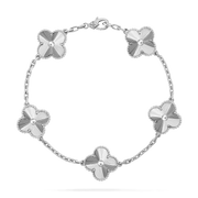 Silver bracelet with floral designs on a white background