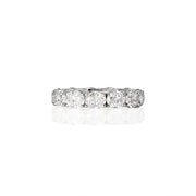 Side view of oval moissanite eternity band showing full-circle design and brilliance
