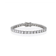 Front view of silver tennis bracelet featuring claw-set moissanite stones with secure clasp