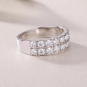 Close-up of ring in warm lighting – Double Row Moissanite detail