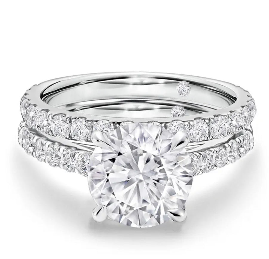 Close-up of Armani Moissanite engagement and wedding ring set in white gold