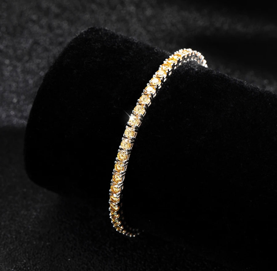 Champagne tennis bracelet displayed on velvet roll