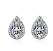 A pair of white color moissanite earrings with a pear cut design, set in silver.
