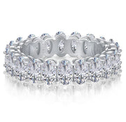 An oval-shaped moissanite band with silver and gold plating, featuring multiple gemstones.
