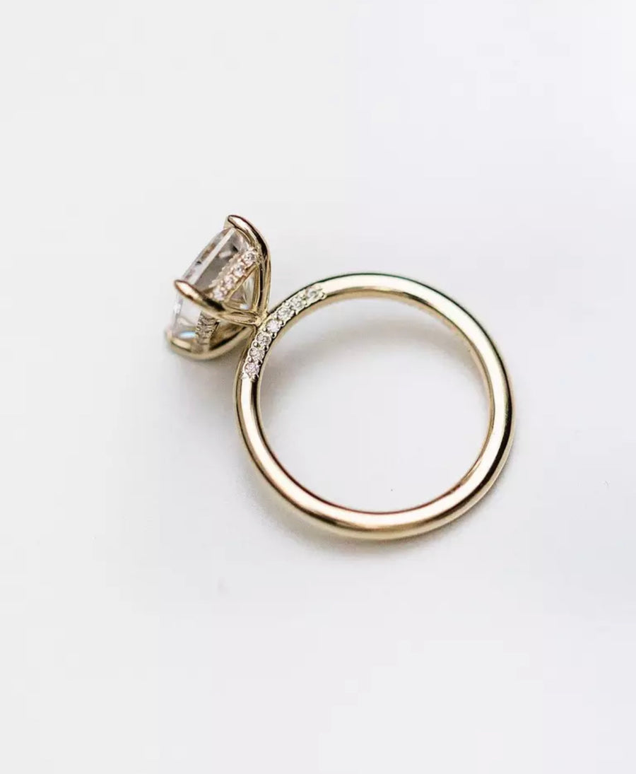 Side view of the Madeline ring in yellow gold setting