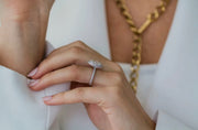 Bride styling the Portia pear Moissanite ring, showcasing elegant double halo design